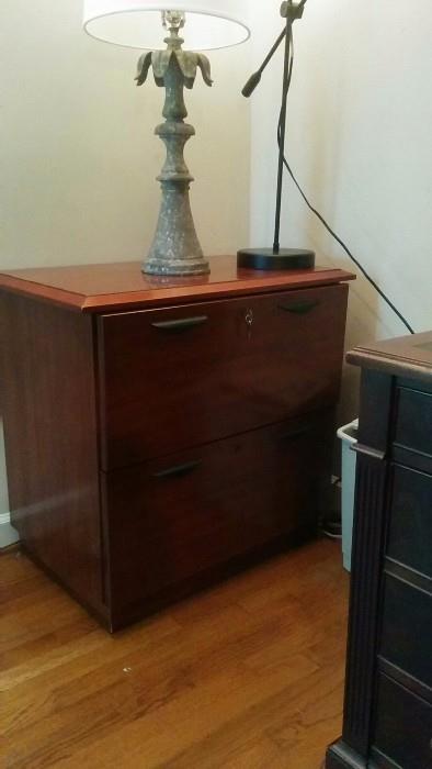 Decent lamp, and a rather decent wooden vertical file cabinet. 
