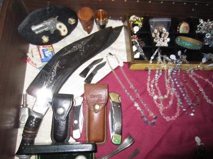 collection of knives, jewelry