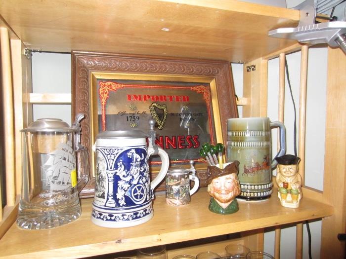 german steins, guiness mirror, toby mug and royal doulton