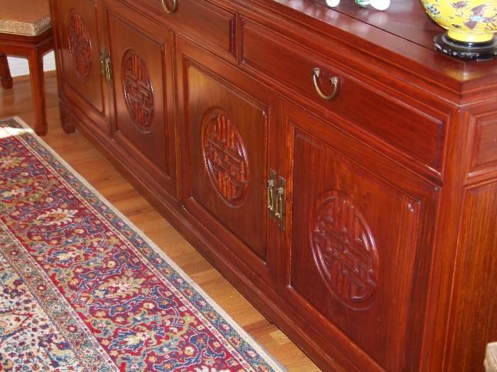 Rosewood buffet hand carved, with lot's of storage and platter dividers and silver drawers. Love this one myself. 