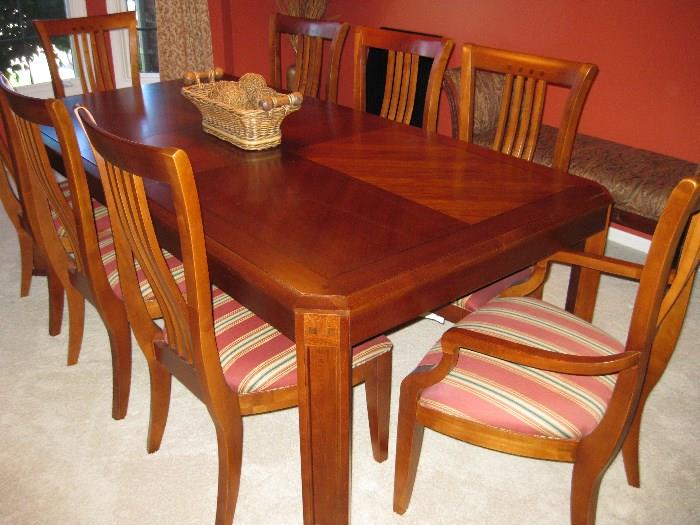 Thomasville dining table with leaf, pads, 4 chairs and 2 captain chairs.  Like new, showroom quality