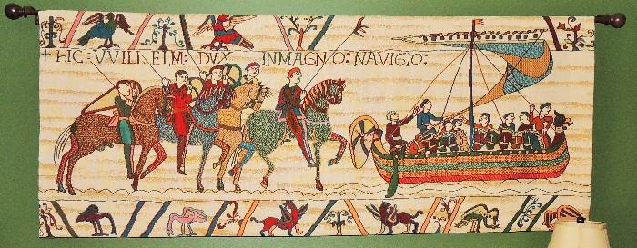 Embroidered copy of a portion of the historic Baueux Tapestry : this segment is six feet long and 28" high and comes with all the necessary hardware AND a Bayeux Tapestry history book : this portion depicts William of Normandy's departure to conquer England on the evenings of September 26-27, 1066.
