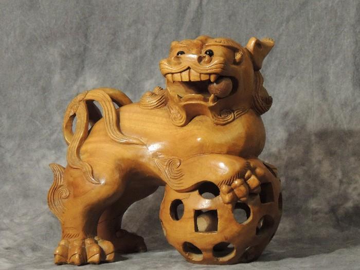 Foo dog, carved from a single piece of wood