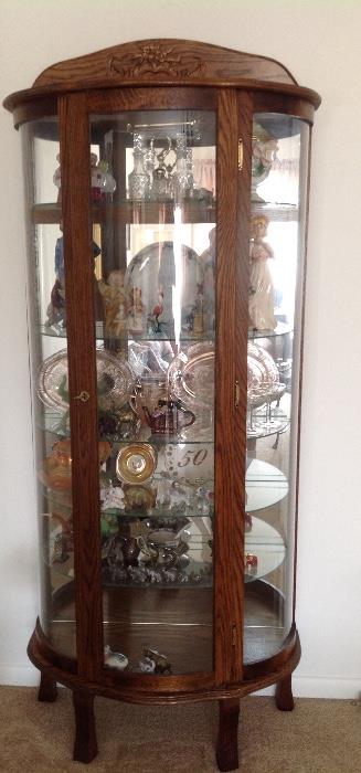 5 Shelf Curio Oval Cabinet with glass shelves.  Great for a corner or against the wall.  Very nice