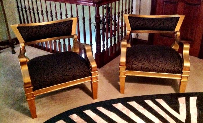 Gold chairs with black upholstery 