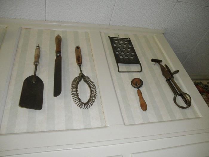 assorted antique kitchen utensils