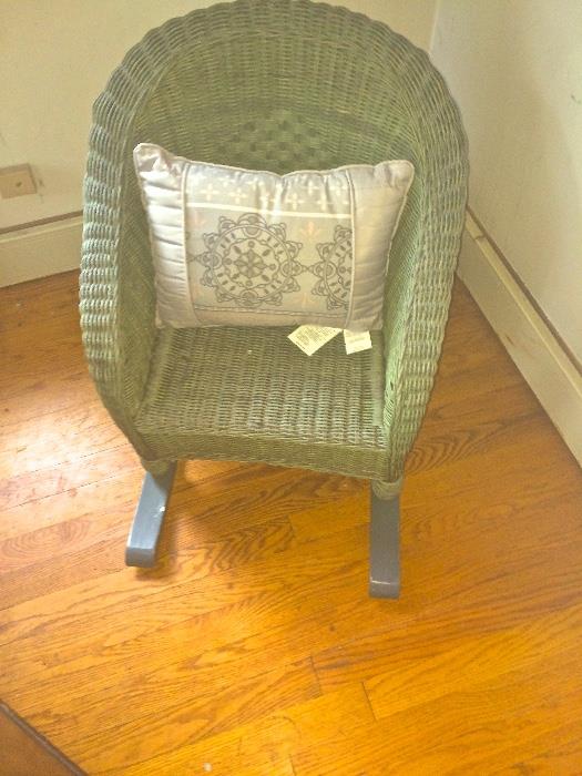 Whimsical antique children's wicker rocker in pale green. One's place to call their own. Lovely to rock in while being read bedtime stories. $150.