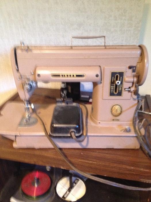 Vintage working Singer sewing machine. Not as pretty as its sister, but a real workhorse. $125.