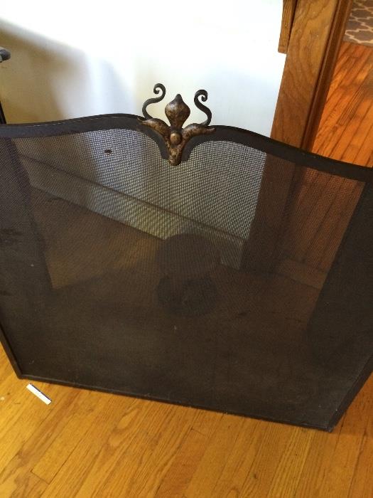 Antique iron 3 piece fire screen w brass embellishments. $395. Weighs a ton.