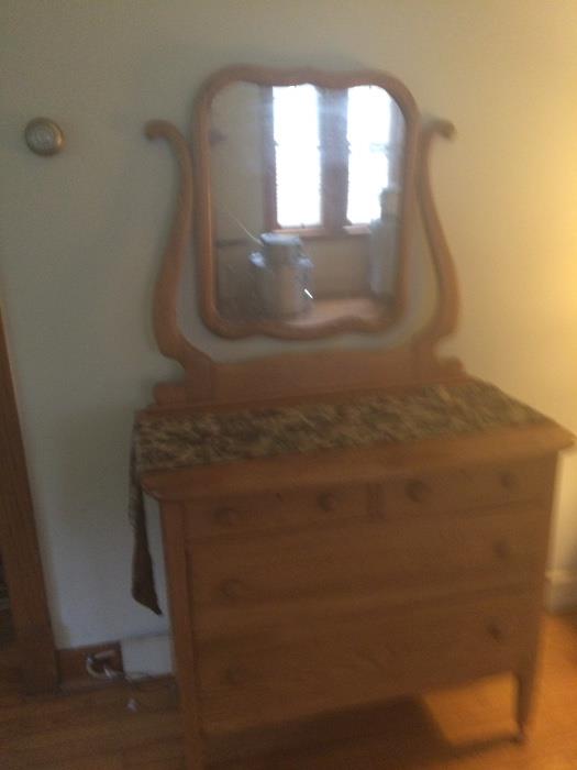 Beautiful oak dresser with four drawers and mirror. Made without nails. $395.