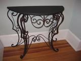 A fun wrought iron table with a chalkboard top.