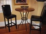 A copper topped bistro pub table and a pair of leather stools - very comfortable!