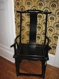 One of a pair of ebonized Chinese arm chairs.