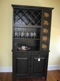 A Kitchen cabinet with wine rack
