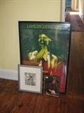 Bob Marley poster, Bob Dylan photo, and somber angel print
