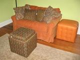 Orange sleep sofa, orange cube, and storage flip-tray cube.