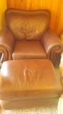 tan/brown leather chair and ottoman