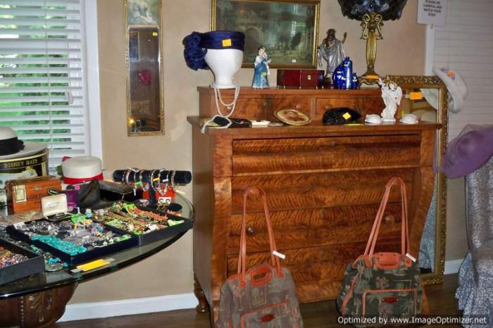 Burl empire chest, hat collection, costume jewelry, glass top pedestal table