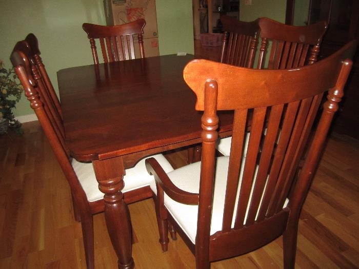 CHERRY TABLE WITH 24 IN HIDDEN LEAF WITH 6 CHAIRS AND MATCHING HUTCH BY KINCAID