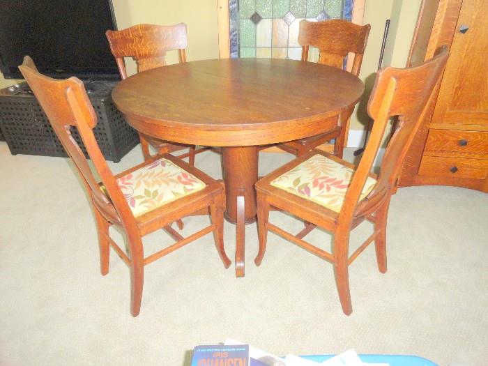 Antique wood round pedestal table and 4 chairs with upholstered seats.. old and gorgeous.. 