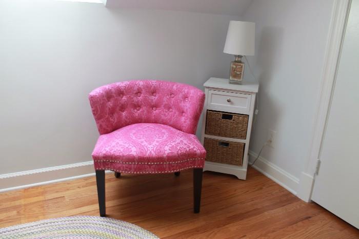 Pink occasional chair, side table, and lamp