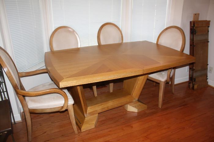 Beautiful oak table with 6 arm chairs.  Seats 12 with leaves.