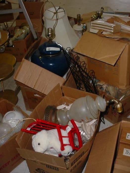 We saw boxes of old lamps. oil lamps, chandeliers, lamp parts, and more.