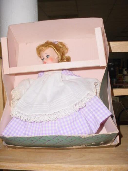 One of the Madame Alexander dolls, and many other dolls