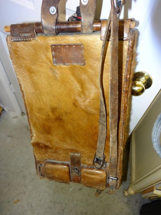 Back side of old cow hide back pack carried by (deceased) forest ranger when on extended patrol.