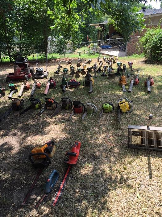 A sample of the chain saws, lawn mowers, weed eaters and blowers. (repairs may be needed)