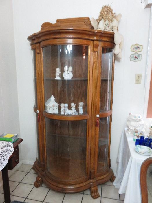 Display cabinet with Precious Moments figurines