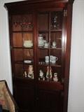         LARGE CORNER CABINET FILLED WITH GLASSWARE AND COLLECTIBLE TOBY JUGS 