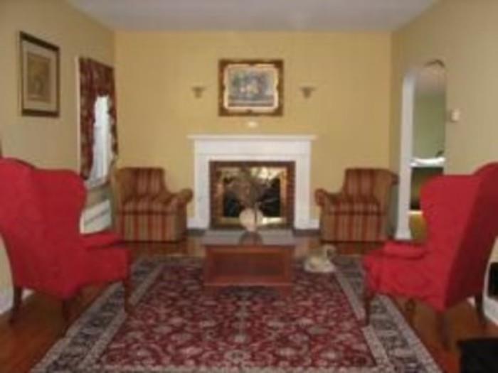 Red Wing Chairs and Coffee Table, painting over mantle