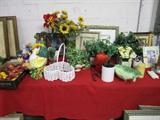 lots of decor, florals, picture frame and tons of artwork big and small pieces