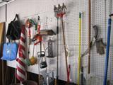 collection of yard tools and garden chemicals