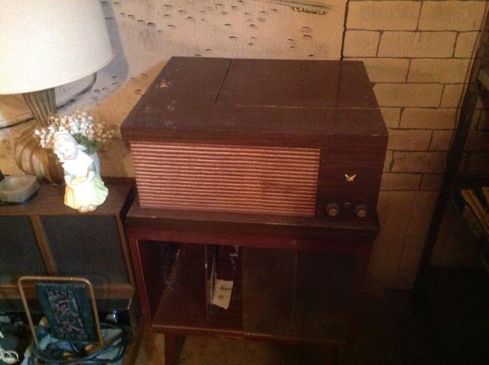 1957 Voice of Music model 560-A MCM 4 speed table top phonograph, and it works. 