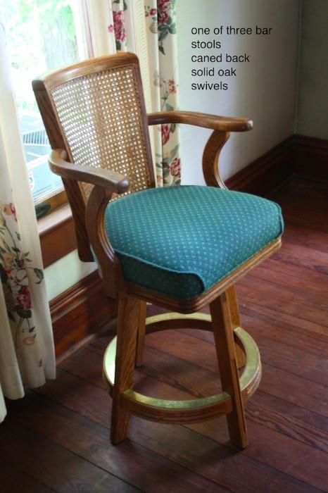 solid oak bar stool. three available. swivels