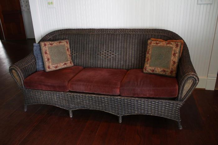 Rattan couch. three cushions