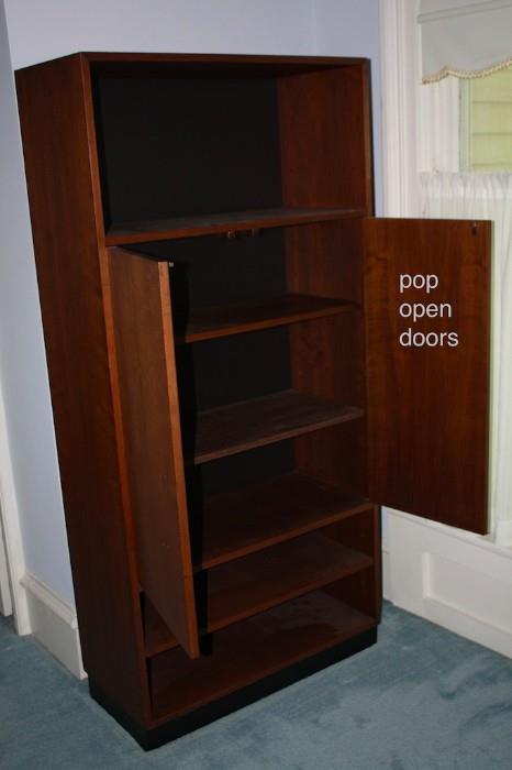 dark wood cabinet. pop open doors