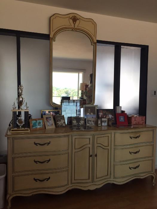 solid wood dresser with matching vanity mirror.