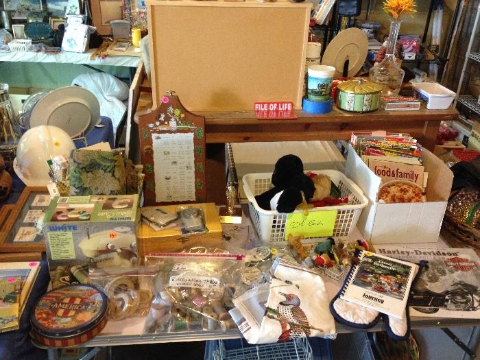 decorative tins, wall decor, Berggren, some sewing supplies, lacy doilies, small sewing machine, Christmas goods, and more