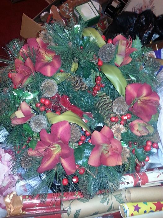One of many Christmas wreathes and Christmas wrapping paper