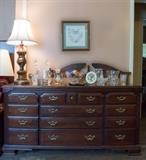 Dresser with mirror that matches California King 4-poster bed, chest of drawers and bedside table