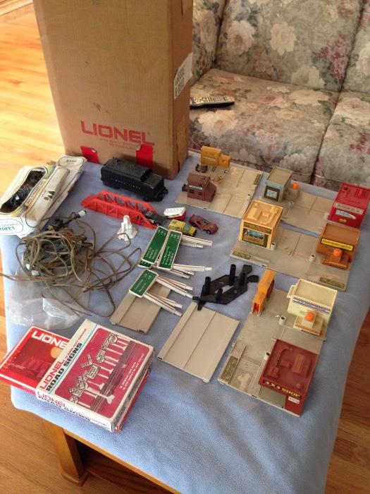 Various Lionel train accessories and coal tender