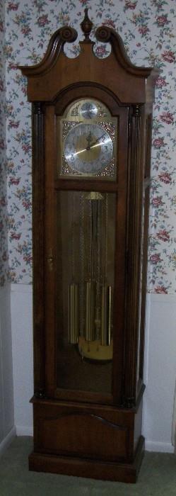 Grandfather Clock with Tempus Fugit (Time Flies) in the Globe symbol above the face; it is fully functional and keeps perfect time. 