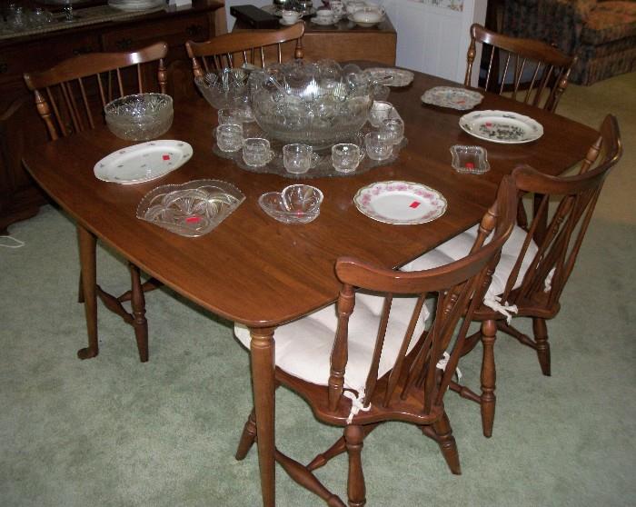 Solid Wood Dining Room Table with Six Chairs and Large Crystal Punch Bowl with Ladles and Cups on top