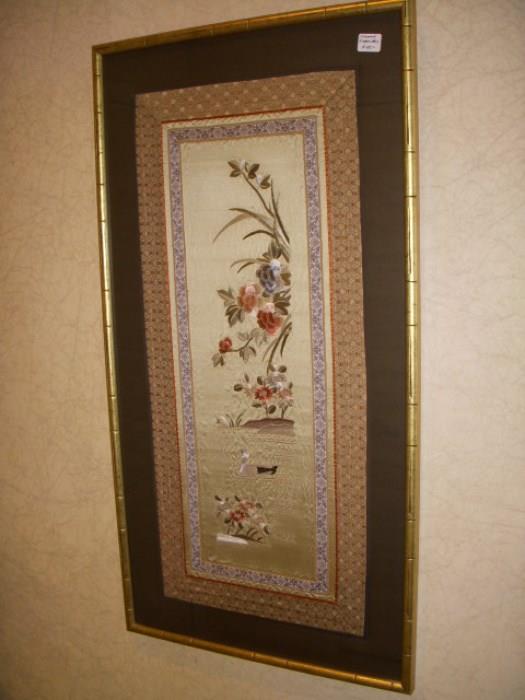 One of the two framed embroideries from China
