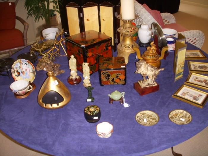 Assorted Oriental style decorative items.  "Teepee" ashtray by Sascha Brastoff is to the left of center