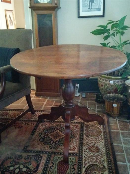 19th century American tilt-top tea table.  Behind is one of the several large Chinese porcelain pots in house.