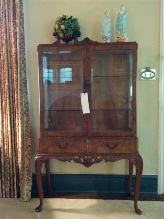 Beautiful burl walnut Curio Cabinet with glass doors and sides and glass shelve. Fine carving. Best quality.